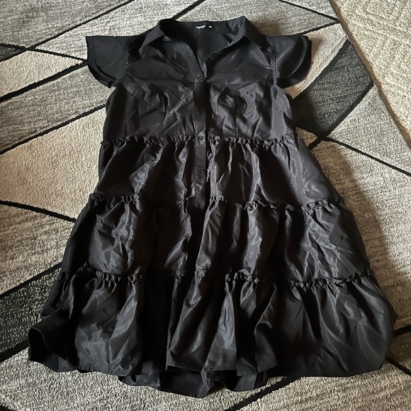Black dress, never worn! Has buttons going down the front, and ruffles! - Picture 1 of 2